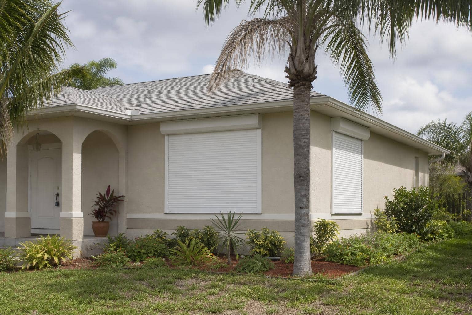Illustration of a Southwest Florida home protected by hurricane shutters
